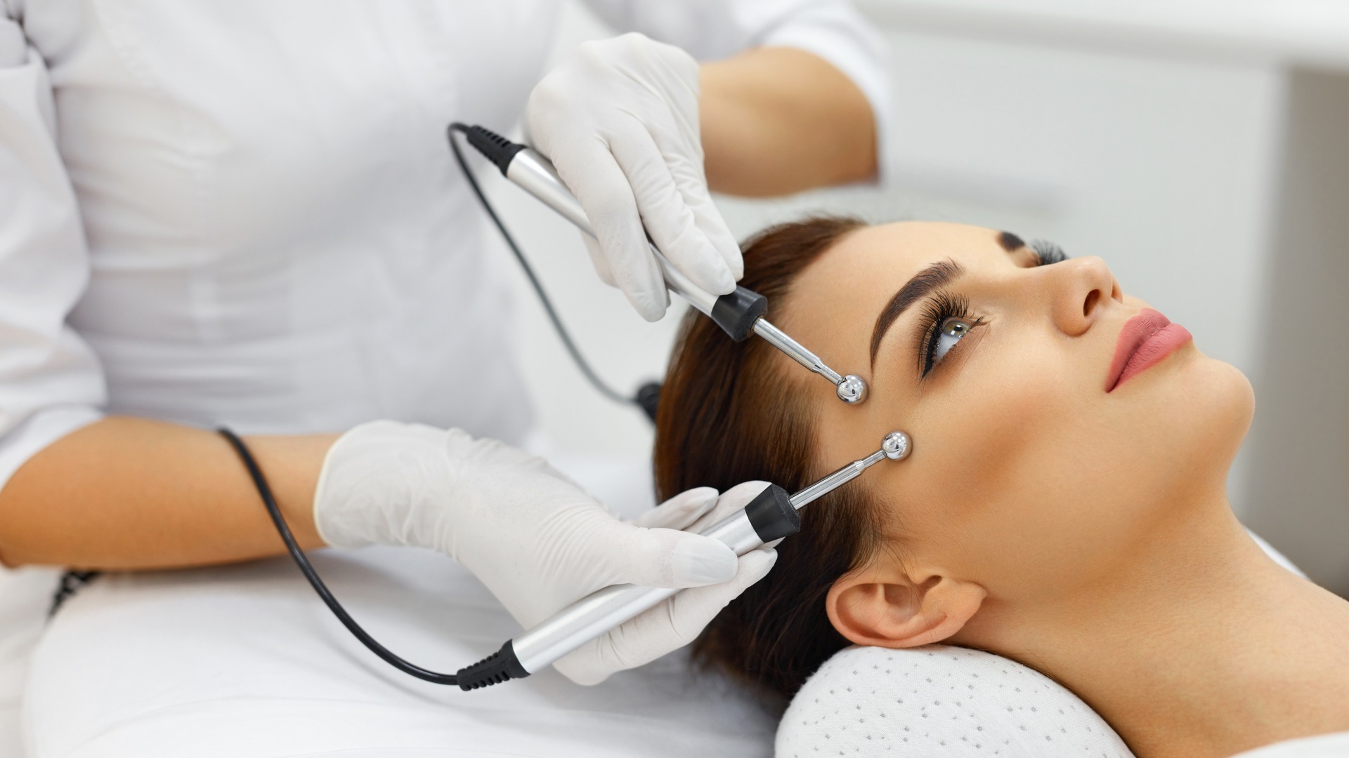 Woman undergoing non-invasive face treatment
